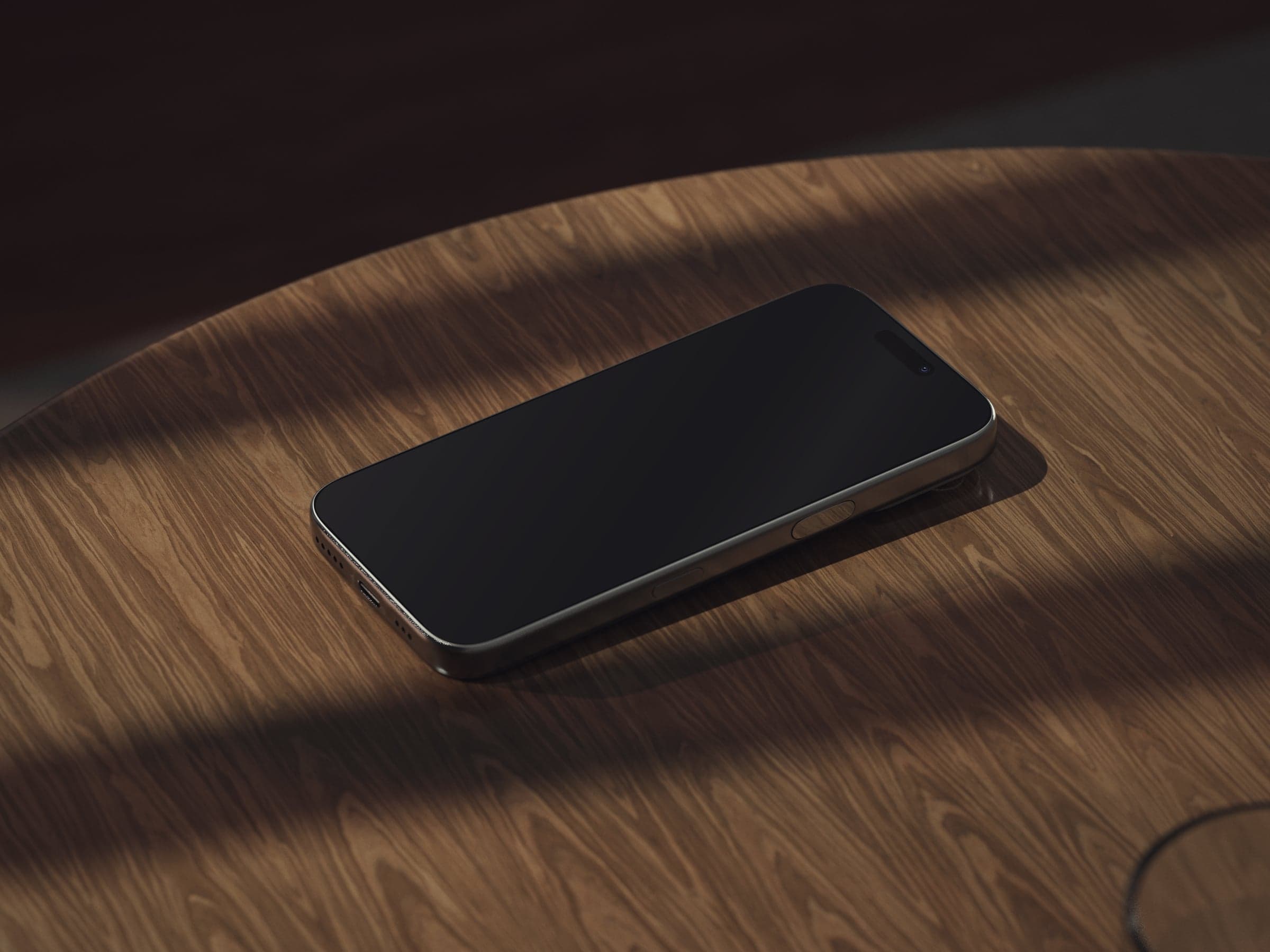 OAK 04 iPhone angled on oak table in sunlight mockup preview