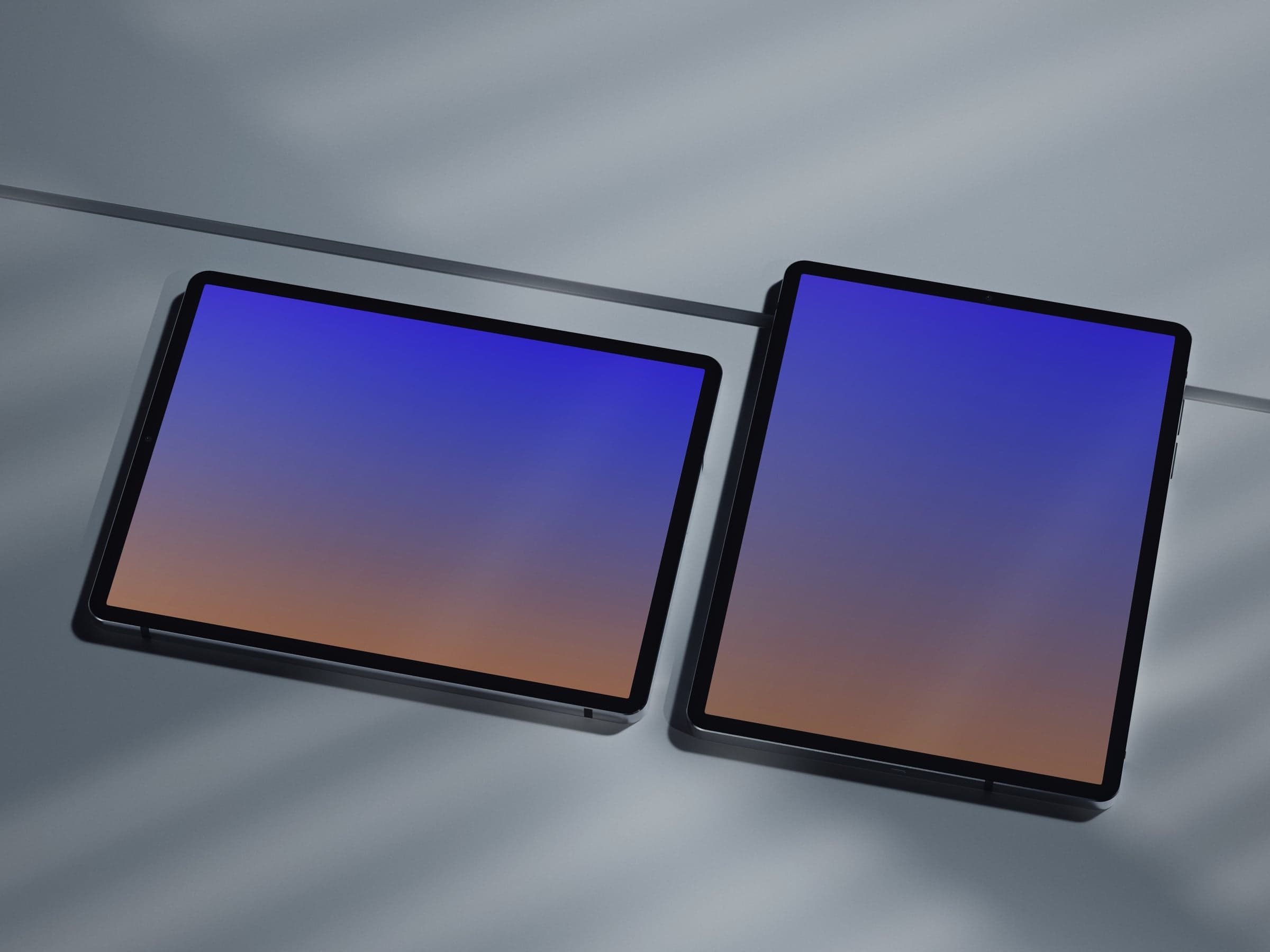 DYL 02 Pair of iPads on a light surface in soft shadows mockup preview