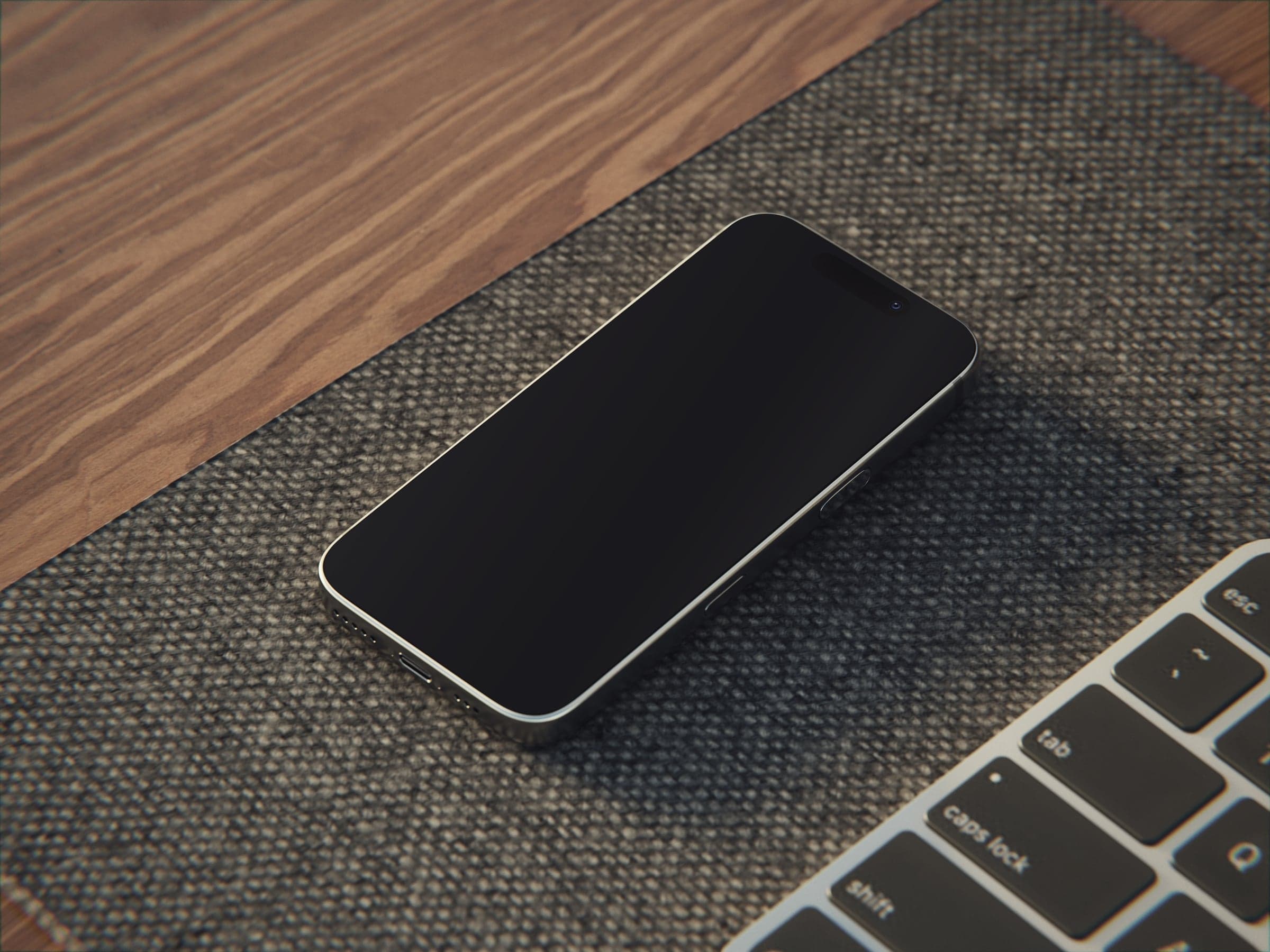 OAK 08 iPhone on a wool desk mat beside a laptop mockup preview